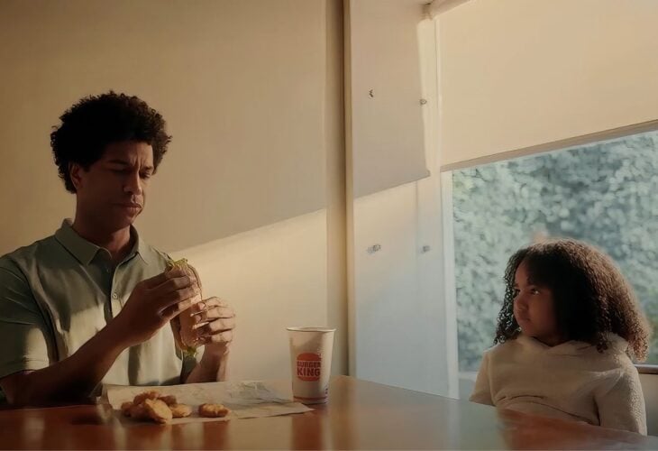 A child eating vegan chicken with her dad in a Burger King "confusing times" advert